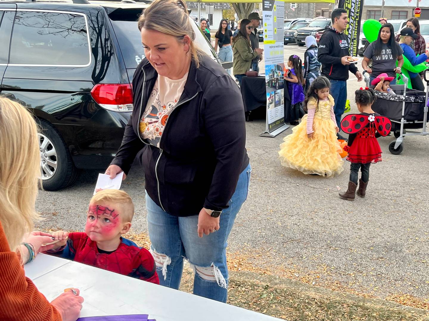 While Plano is famous for the filming of a Superman film, a tiny Spiderman was the one collecting all the candy at the town's "Treats in the Streets" Halloween event.