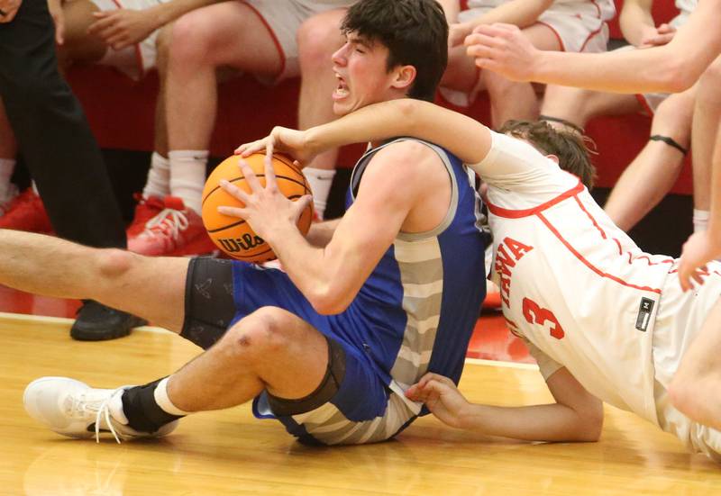 Princeton's Noah LaPorte beats out Ottawa's Connor Diederich to a loose ball on Monday, Feb. 3, 2025 in Kingman Gymnasium at Ottawa High School.