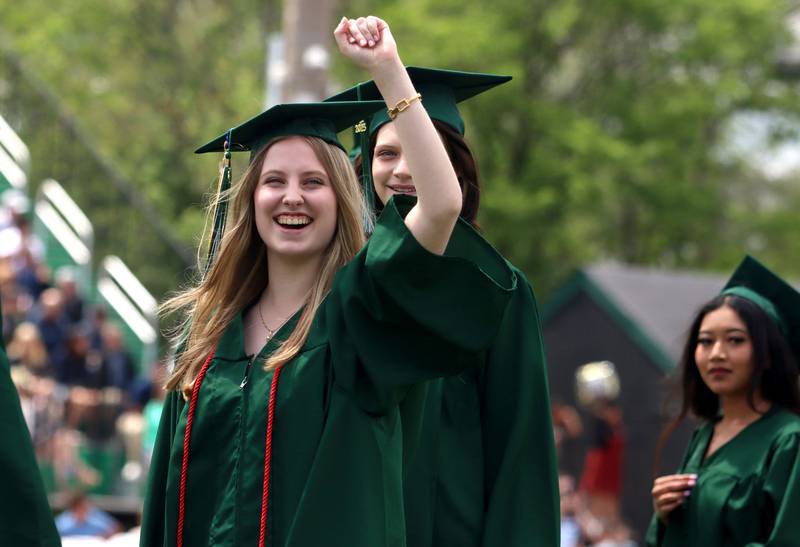 Jessica Schulz pumps her fist as she enters the stadium for  graduation at York High School in Elmhurst on Sunday, May 18, 2025.