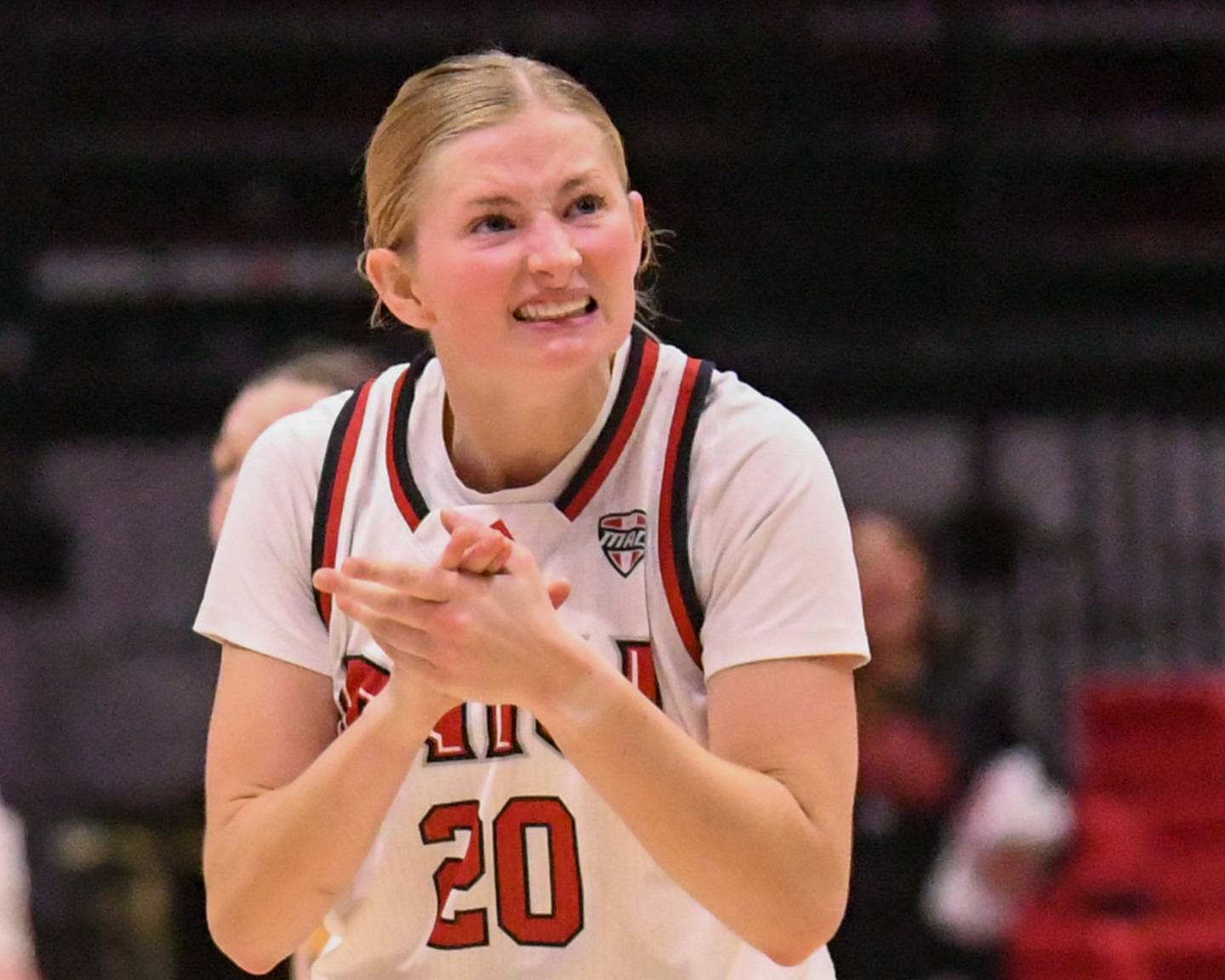 Northern Illinois University's Lexi Carlsen (20) celebrates a three-point basket late in the second half of the game on Saturday Jan. 11, 2025, while taking on Western Michigan University held at the Convocation Center in DeKalb.