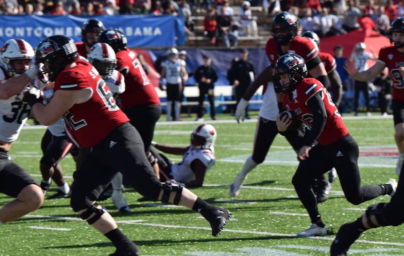 NIU kicker Kanon Woodill run for a touchdown on a fake field goal attempt in the Huskies' Camellia Bowl game against Arkansas State on Saturday, December 23, 2023.