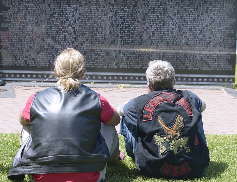 Many who participated in the Annual Illinois Motorcycle Freedom Run, sat with a moment of reflection Saturday at the granite Middle East Conflicts Wall Memorial that has over 8,000 names of those who lost their lives etched in the wall.
