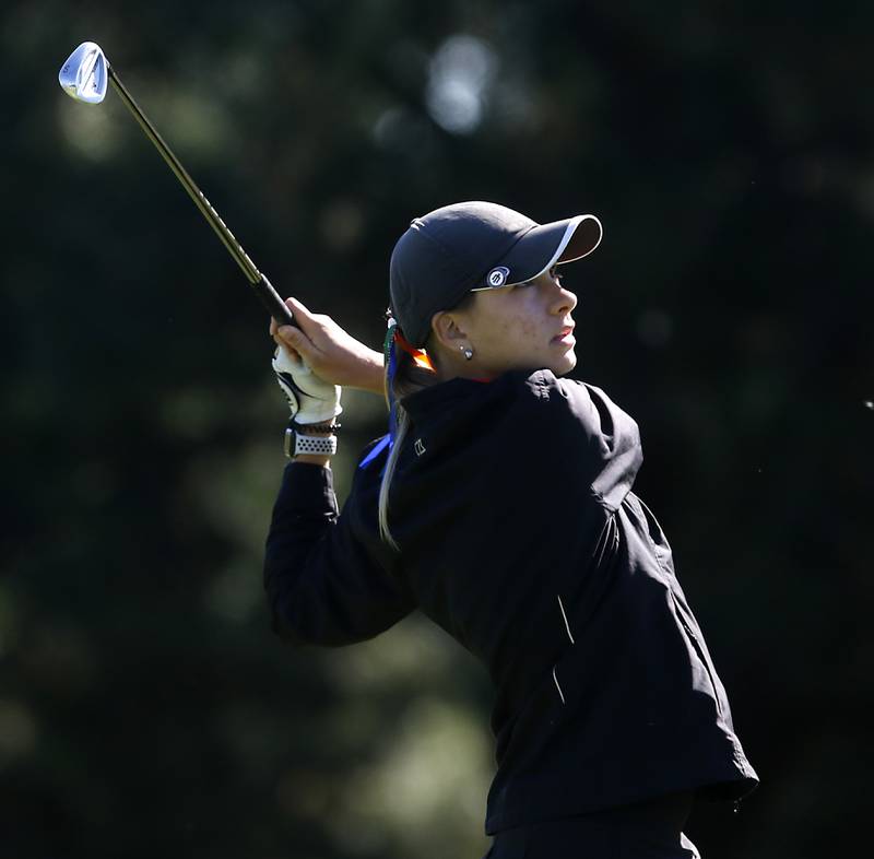 Crystal Lake Co-op’s Madeline Trannell watches her tee shot the eight hole during the IHSA Class 2A Huntley Girls Golf Regional on Tuesday, Oct. 1, 2024, at Pinecrest Golf Club in Huntley.