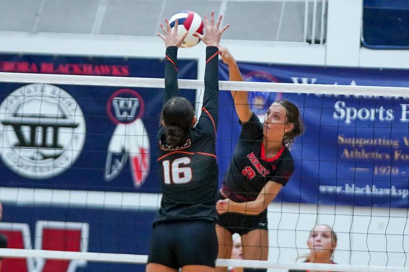 Benet’s Gabriele Stasys (2) goes up for a kill attempt against Wheaton Warrenville South's Tessa Gonzalez (16) during a Class 4A West Aurora Sectional semifinal volleyball match at West Aurora High School on Tuesday, Nov. 5, 2024.