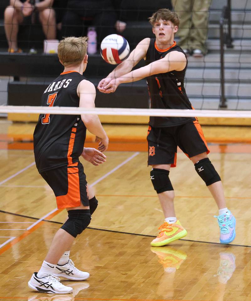 DeKalb’s Tyler Brackemyer receives a serve Tuesday, April 21, 2026 during their match against Naperville North JV at DeKalb High School.