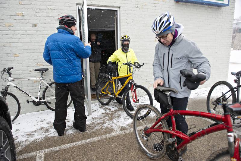 2022 FILE: Green River Cyclery owner BJ Fenwick (right) prepares his bike for his annual New Years Day bicycle ride Saturday, Jan. 1, 2022 in Dixon.