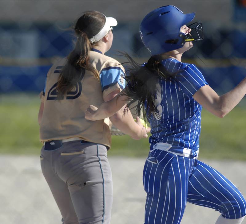Newman runner Veronica Haley is out at first. Marquette traveled to Newman' to play a game on Friday, May 16, 2025