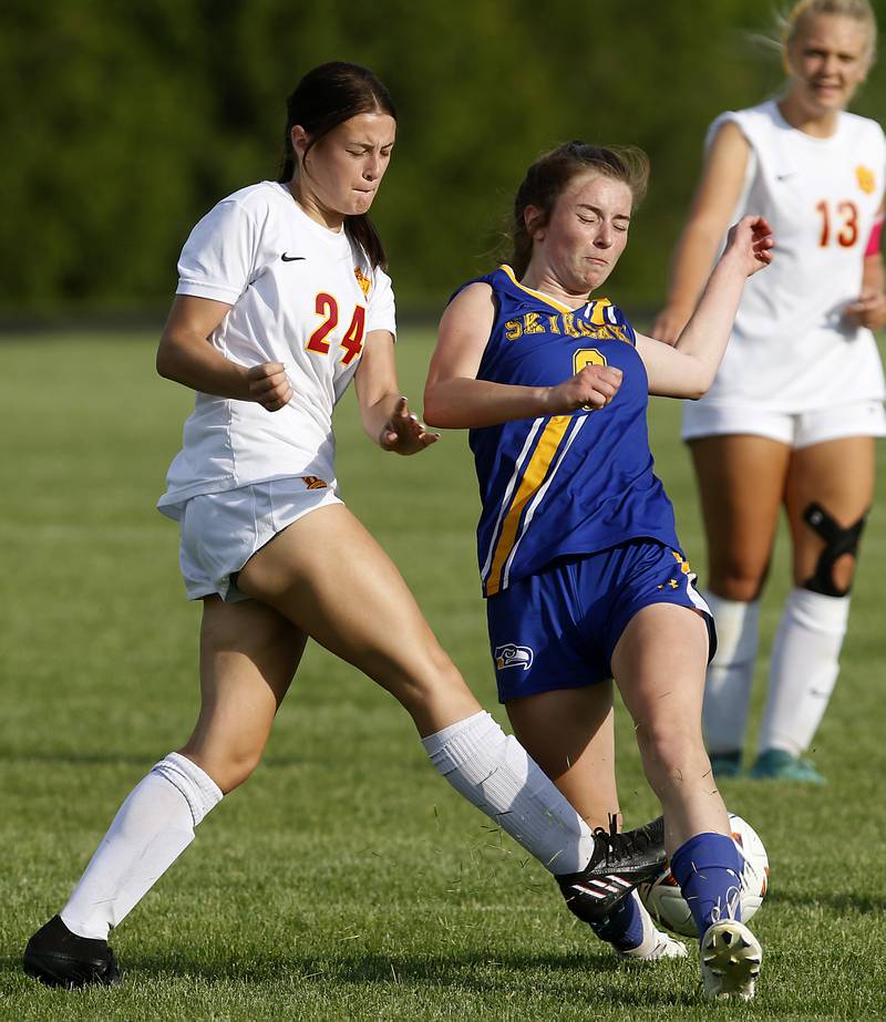 Richmond-Burton's Ember Demers kicks the ball away from Johnsburg's Kaylee Fouke during the IHSA Class 1A Marian Central Sectional Championship match on Tuesday, May 21, 2024, at Marian Central High School.