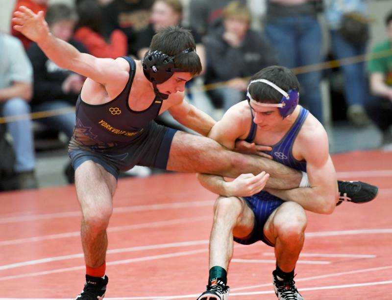 Newman's Carter Rude holds the leg of Yorkville Christian's Grason Johnson in their 138-pound match at the 1A Oregon Wrestling Sectional on Friday night.