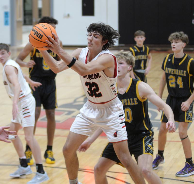 Forreston's Jonathan Milnes (32) rebounds against Riverdale on Friday, Dec. 27, 2024 at the Cliff Warkins Memorial Basketball Tournament at Erie High School.