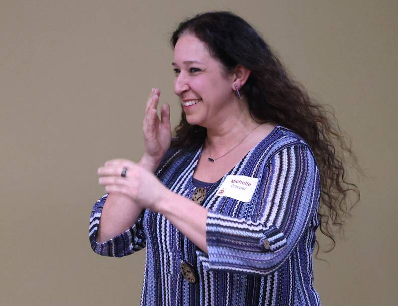 Michelle Groeper from Tails Humane Society comes up to accept the Nonprofit Organization award on behalf of Tails Thursday, Feb. 5, 2026, during the DeKalb Chamber of Commerce Annual Celebration Dinner at Faranda's Banquet & Conference Center.