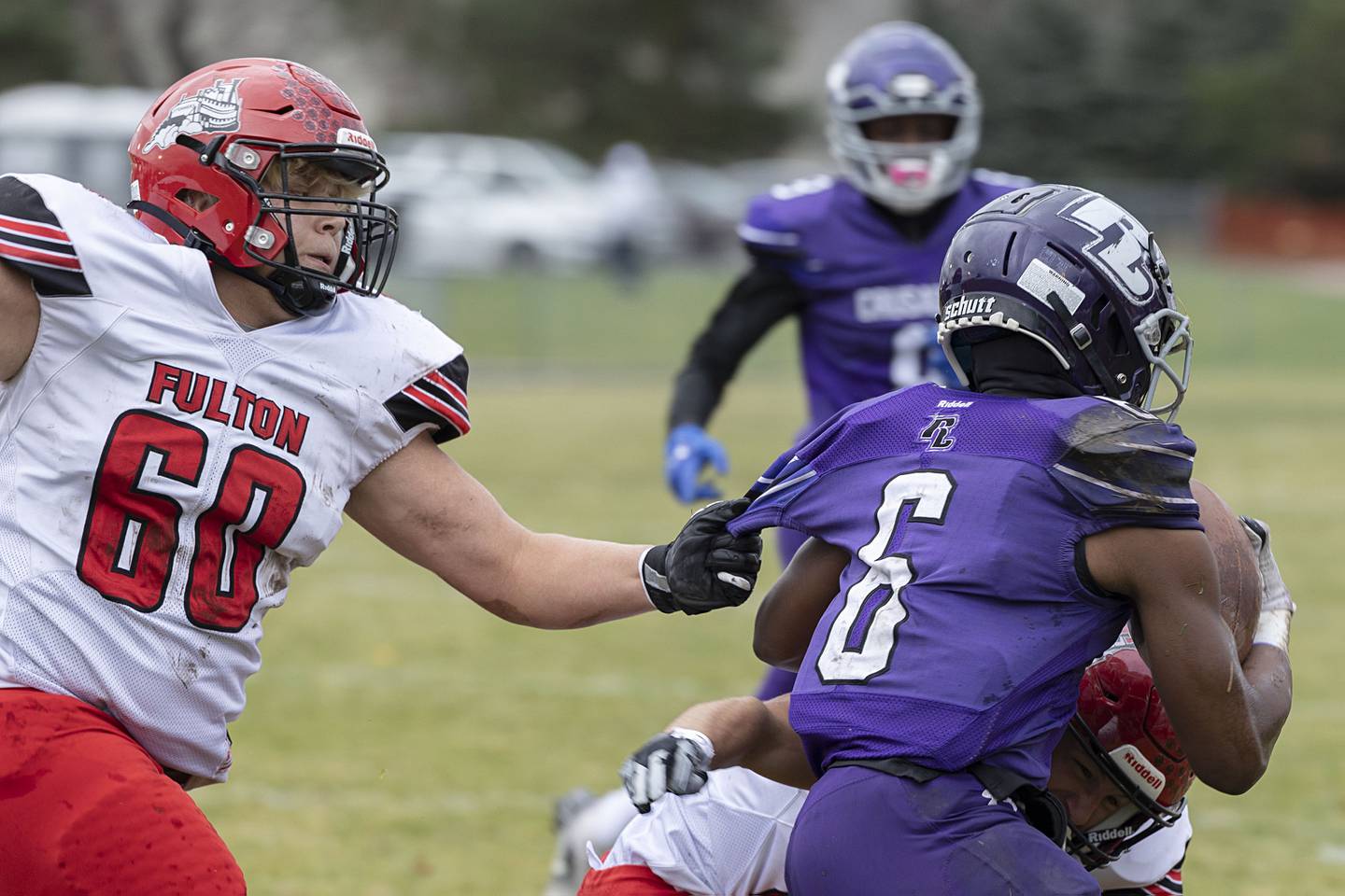 Fulton’s Braiden Damhoff snatches the sleeve of Rockford Lutheran’s Arlin Moore Jr. Saturday, Nov. 5, 2022 during a round two football playoff game.