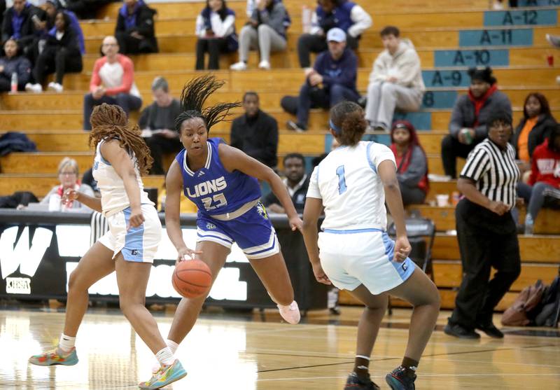 Lyons Township's Nora Ezike drives toward the basket during the West Suburban Conference championship game against Downers Grove South on Thursday, Feb. 13, 2025 at Willowbrook High School.