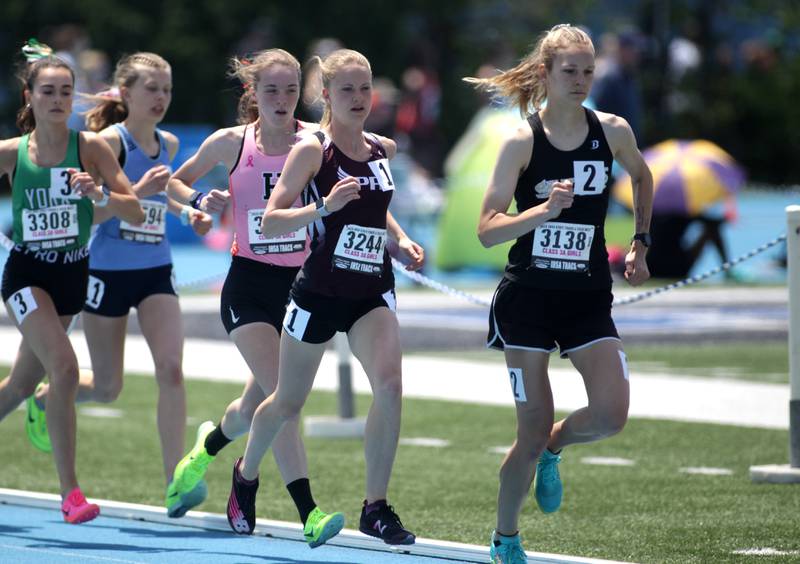 Glenbard North’s Grace Schager (right) and Prairie Ridge’s Rachel Soukup (second from right) compete in the 3A 3200-meter run during the IHSA State Track and Field Finals at Eastern Illinois University in Charleston on Saturday, May 20, 2023.