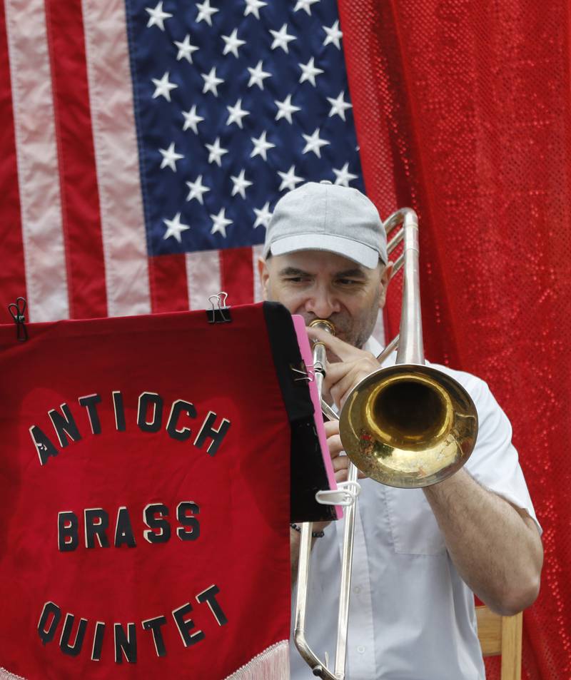 A member of the Antioch Brass Quintet performs during the Lake Bluff Fourth of July parade on Friday, July 4, 2025, in Lake Bluff.