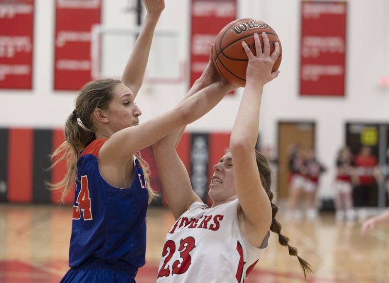 Eastland’s Trixie Carroll works against Amboy’s Maeve Larson Wednesday, Jan. 18, 2023.