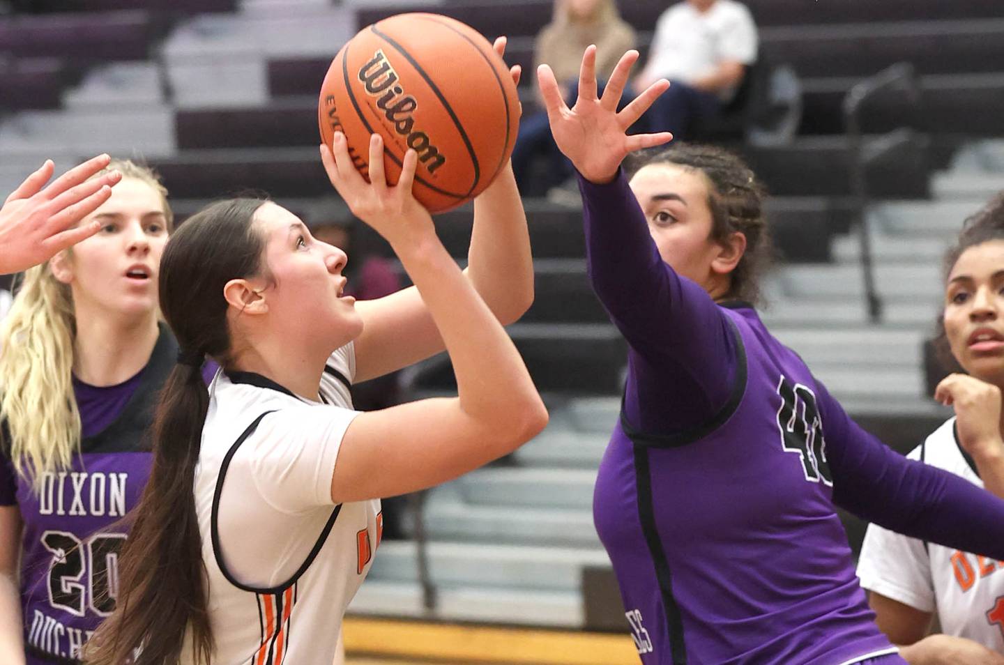 DeKalb's Ella Medina shoots past Dixon’s Hallie Williamson during their game Monday, Jan. 23, 2023, at DeKalb High School.