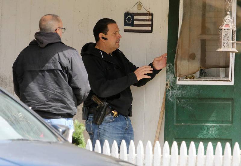 Crystal Lake Police officers approach the house of Drew Freund, father of missing 5 year old Andrew (AJ) Freund,  on Dole Ave on Friday, April 19, 2019 in Crystal Lake.