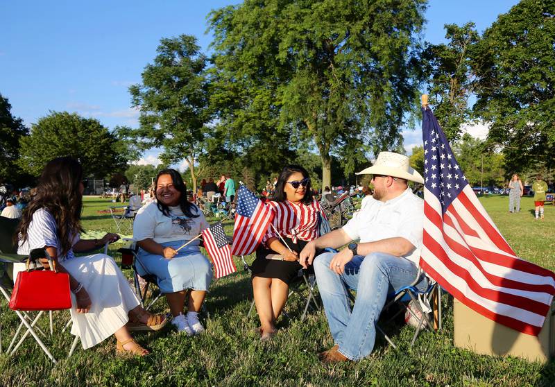 (Left to right) Odalis Crisostomo, Leslie Crisostomo, Monica Stepp and Matt Stepp chat before the Elburn Fireworks Show at Lions Park on Saturday, July 6, 2024 in Elburn.