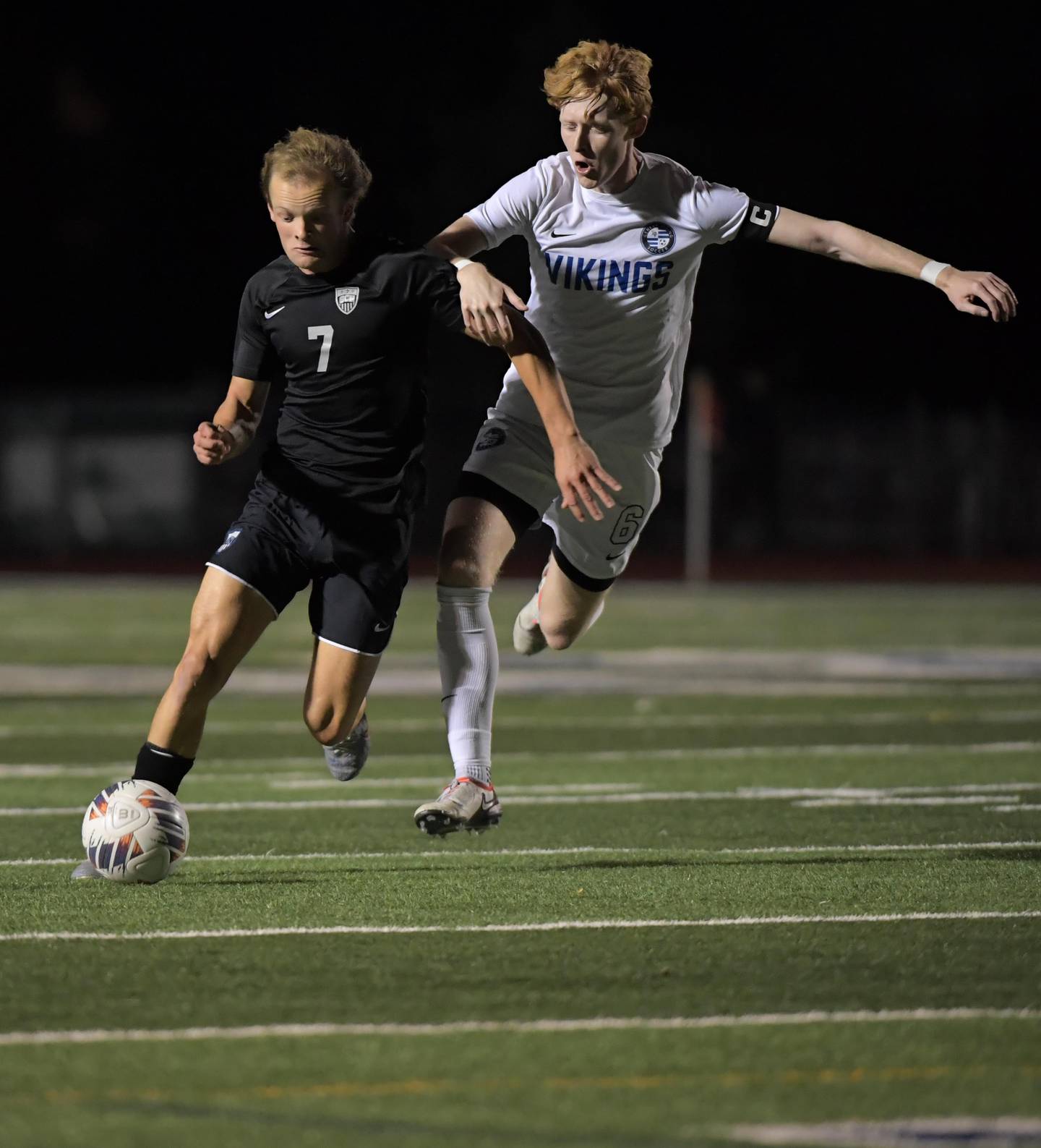 St. Charles North’s Trevor Mirra controls the ball against Geneva’s Liam O'Donoghue in a boys soccer game in St. Charles on Tuesday, October 10, 2023.