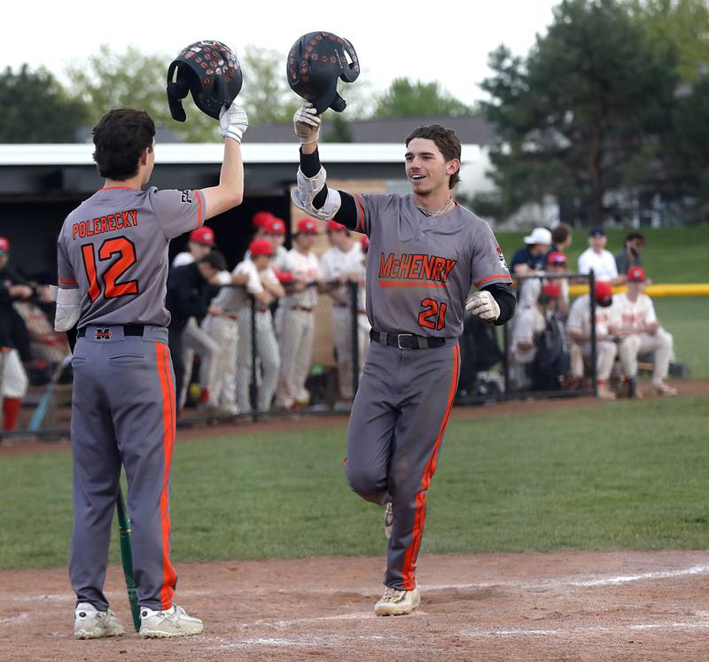 McHenry's Nathan Neidhardt (right) celebrates his home run with his teammate, am Polerecky, during a Fox Valley Conference baseball game against Huntley on Tuesday, May 8, 2026, at Huntley High School.
