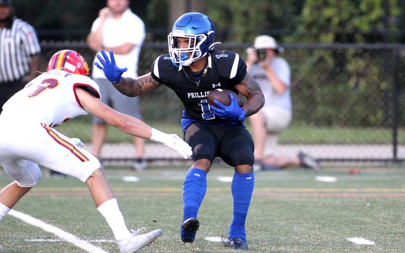 Rayshaun Thompson of Phillips carries the ball during a game against Batavia at Gately Stadium in Chicago on Saturday, Aug. 27, 2022.