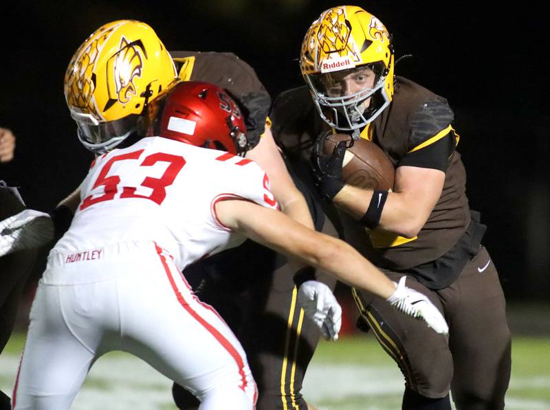 Jacobs’ Caden DuMelle looks for running room against Huntley in varsity football at Jacobs High School in Algonquin on Friday, Sept. 26, 2025.