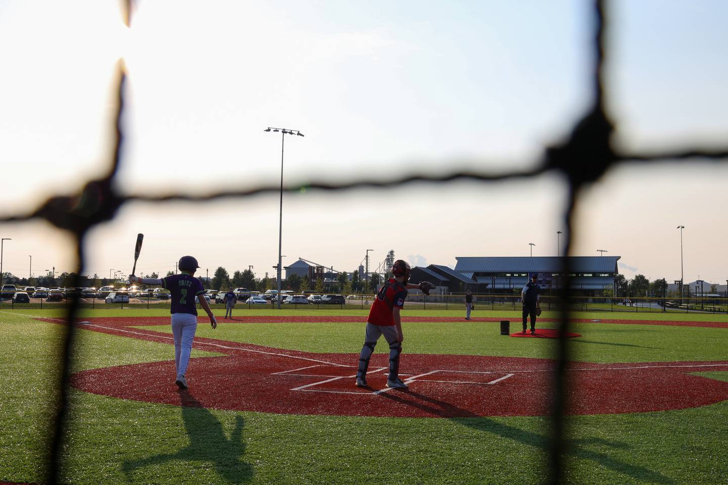 Players from the Bourbonnais Braves youth baseball program practice on a field at Bradley's 315 Sports Park during a Bradley Business After Hours event on Tuesday, July 29, 2025.