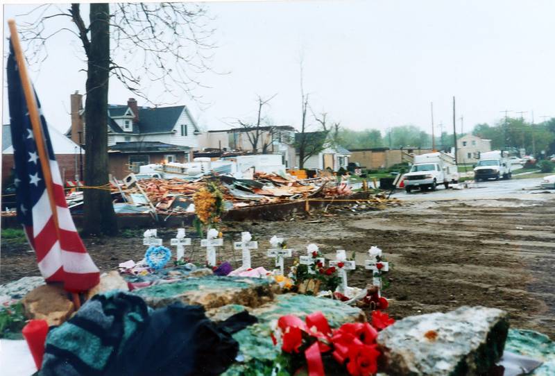 Crosses remembering the victums that were killed in the tornado act as a memorial near the enterance to the Milestone Tap in 2004.