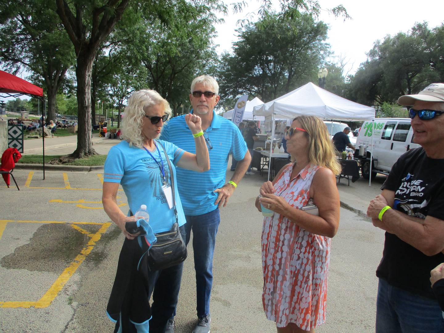 Laurie Morvan (left), a native of the Joliet area who now lives in California, greets family and friends after arriving with her Laurie Movan Band on Saturday, Aug. 13, 2022 at the Joliet Blues Festival in Billie Limacher Bicentennial Park.