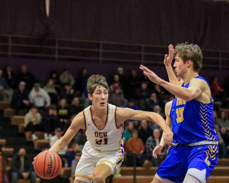 Downers Grove North's Jack Stanton (21) makes a move during varsity basketball game between Lyons at Downers Grove North.  Jan 31, 2023.