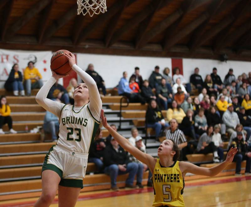 St. Bede's Ali Bosnich runs past Putnam County's Eme Bouxsein to score a basket during the Tri-County Conference Tournament championship game on Thursday, Jan. 18, 2024 at Henry-Senachwine High School.