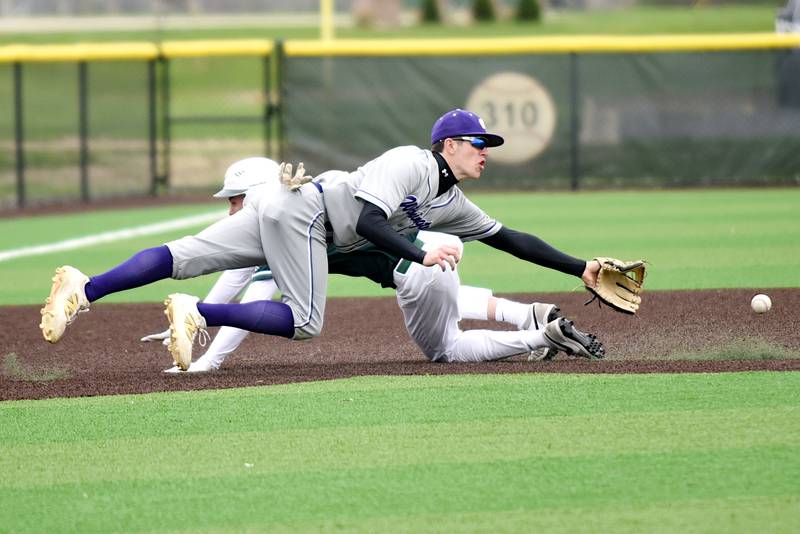 Wilmington's Declan Moran, front, dives to field a throw to third base as Coal City's Dylan Young dives into third during a game at Coal City Monday, April 21, 2025.