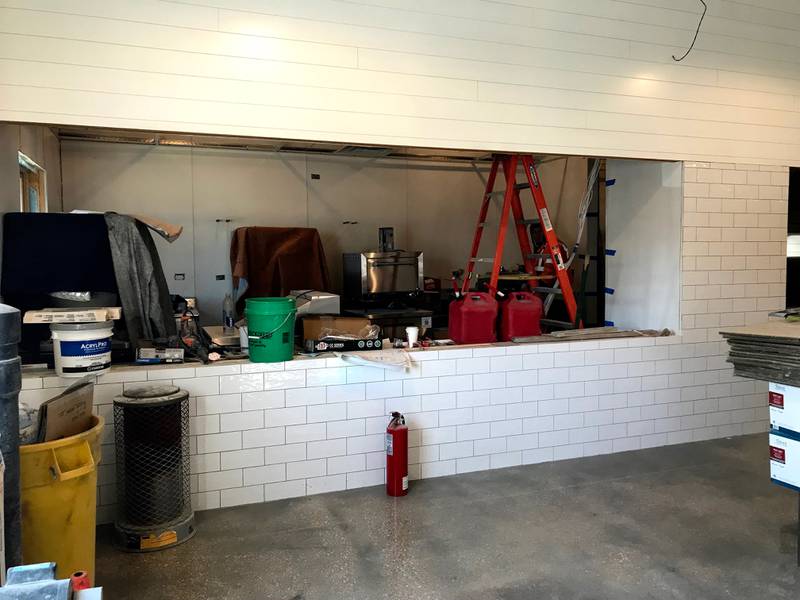 Customers can step up to the subway tile-adorned counter and place their order inside the Dairy Barn when it opens this February in downtown Oswego.