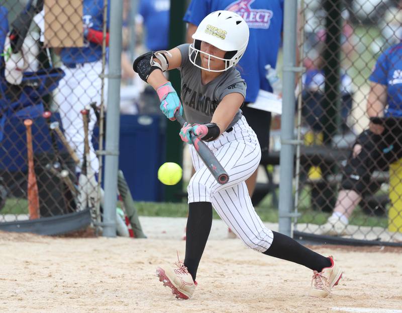 Sycos' Rese Symons lays down a bunt Friday, June 27, 2025, during their 16u game against Select Fastpitch in the Storm Days tournament at the Sycamore Community Sports Complex.