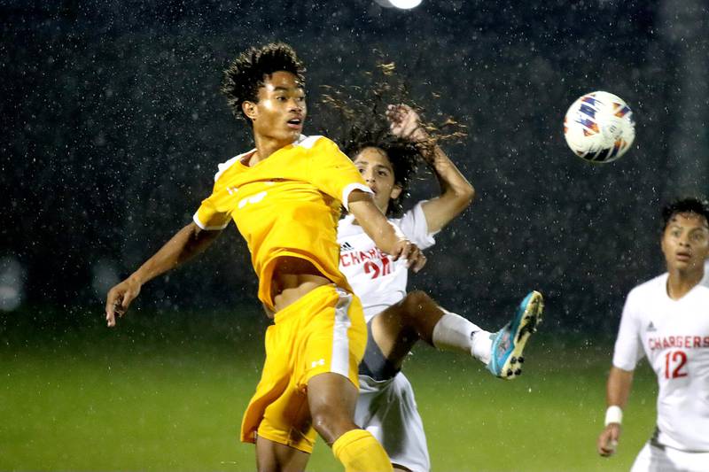 Dundee-Crown’s Sebastian Sanchez, back, battles Jacobs’ LZ McIntosh, front, in boys soccer at Algonquin Tuesday evening.