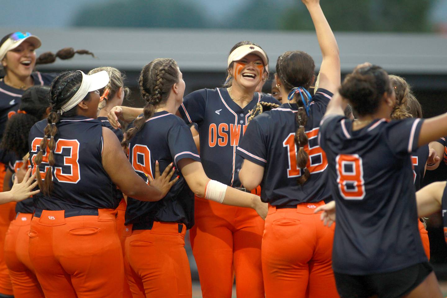 Oswego players celebrate their IHSA Class 4A state semifinal game win over Oak Park-River Forest on Friday, June 13, 2025 at the Louisville Slugger Sports Complex in Peoria.