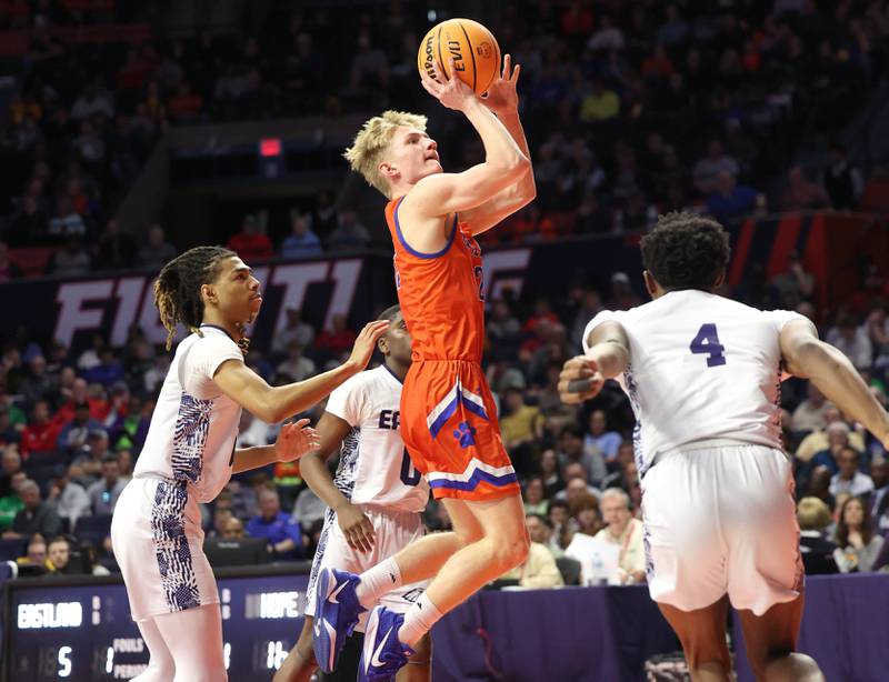Eastland's Adam Awender gets up a shot between three Chicago Hope defenders during their IHSA Class 1A state championship game Saturday, March 15, 2025, in the State Farm Center at the University of Illinois in Champaign.