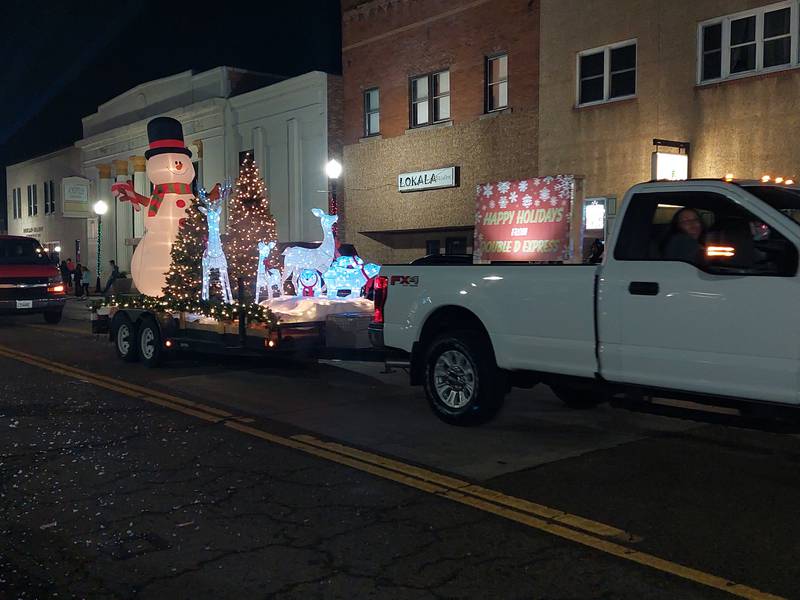 A lighted Christmas float from Double D Express rides Saturday, Dec. 2, 2023, in the Lighted Christmas Parade in Peru.