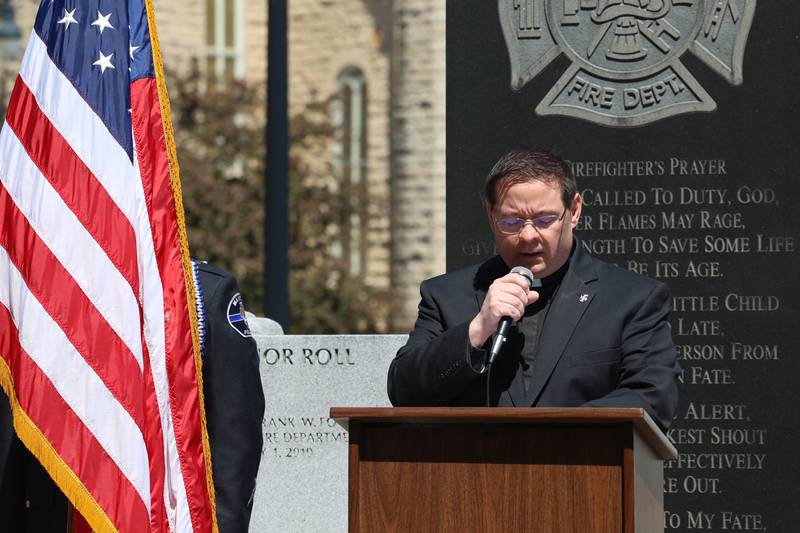 Father Matthew Pratscher, of Kankakee's St. John Paul II Catholic Church, gives the invocation during the Kankakee County Law Enforcement Memorial on Thursday, May 14, 2026, at the Kankakee County Courthouse.