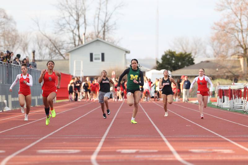 Athletes compete in the girls 100-meter dash during the Boilermaker Invite on Thursday, April 3, 2025.