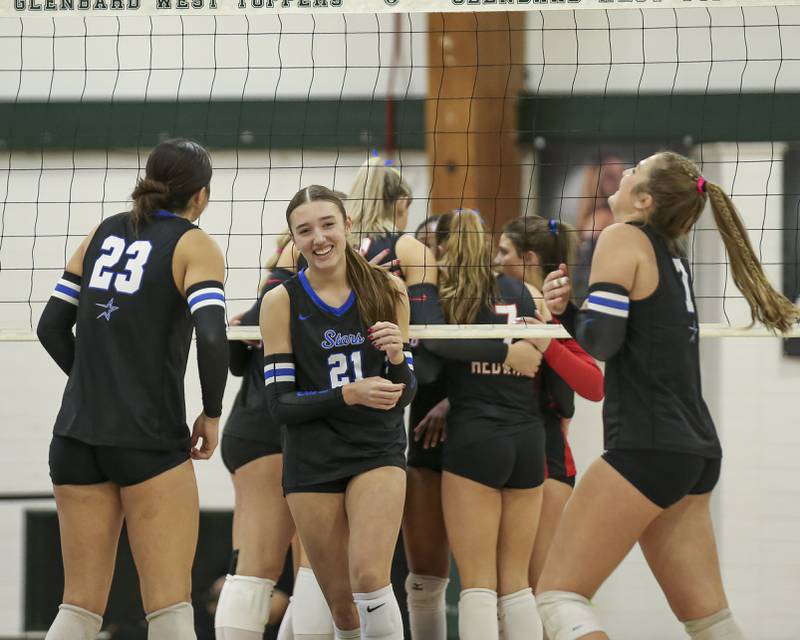St Charles North celebrates a point during Class 4A Glenbard West Sectional final volleyball match between St Charles North at Benet. Nov 6, 2025 in Glen Ellyn.