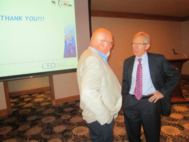 John Greuling (right), chief executive officer for the Will County Center for Economic Development, discusses Interstate 80 plans with Will County Board Member Dan Moran, D-Romeoville, after a presentation on the subject on Monday.