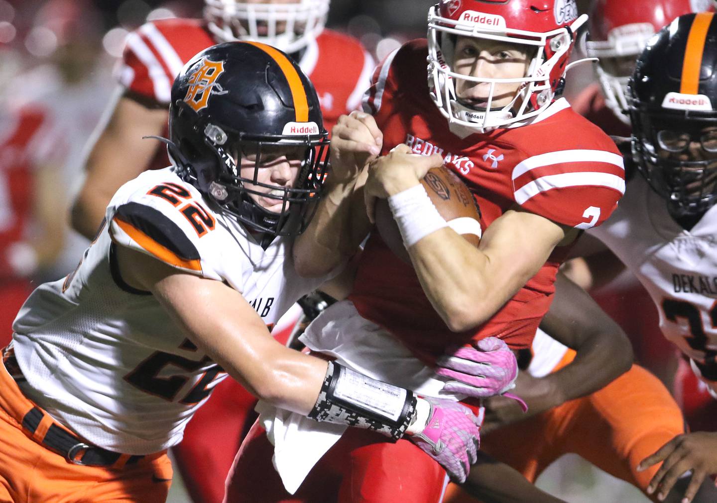 DeKalb linebacker Aiden Sisson brings down Naperville Central quarterback Owen Prucha during their game Friday, Oct. 8, 2021, at Naperville Central High School.