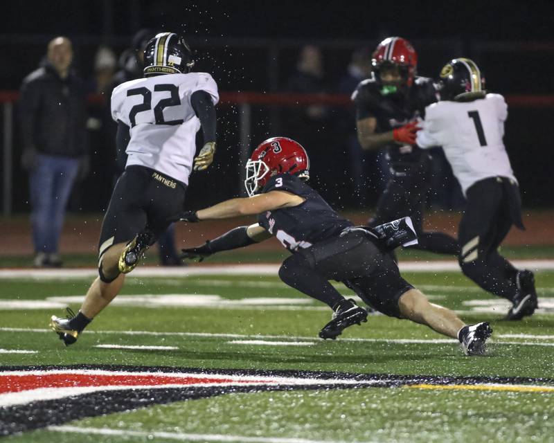 Yorkville's Luke Hendershott (3) dives at Glenbard North's Donato Gatses (22) during Class 7A first round football game between Glenbard North at Yorkville. Friday, Oct 31, 2025 in Yorkville.