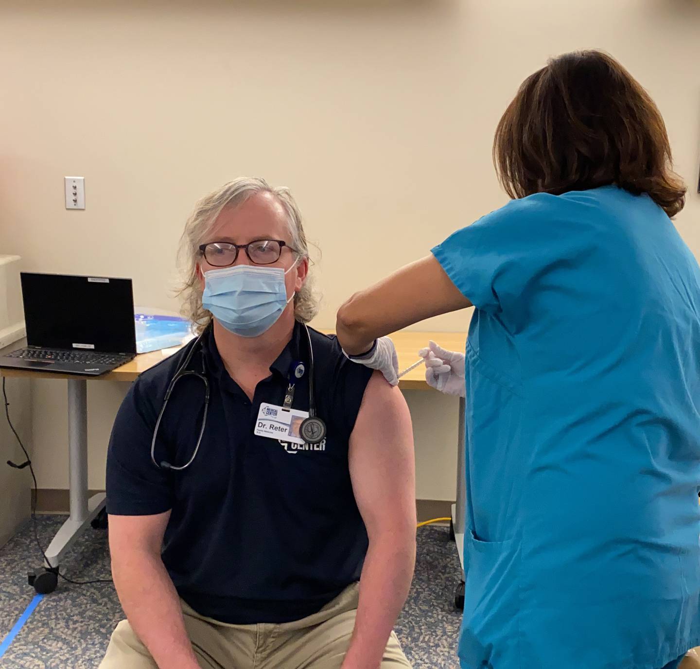 CGH Medical Center family medicine specialist Dr. Jason Reter (left) receives his first dose of the COVID-19 vaccine on Thursday, Dec. 17, 2020.