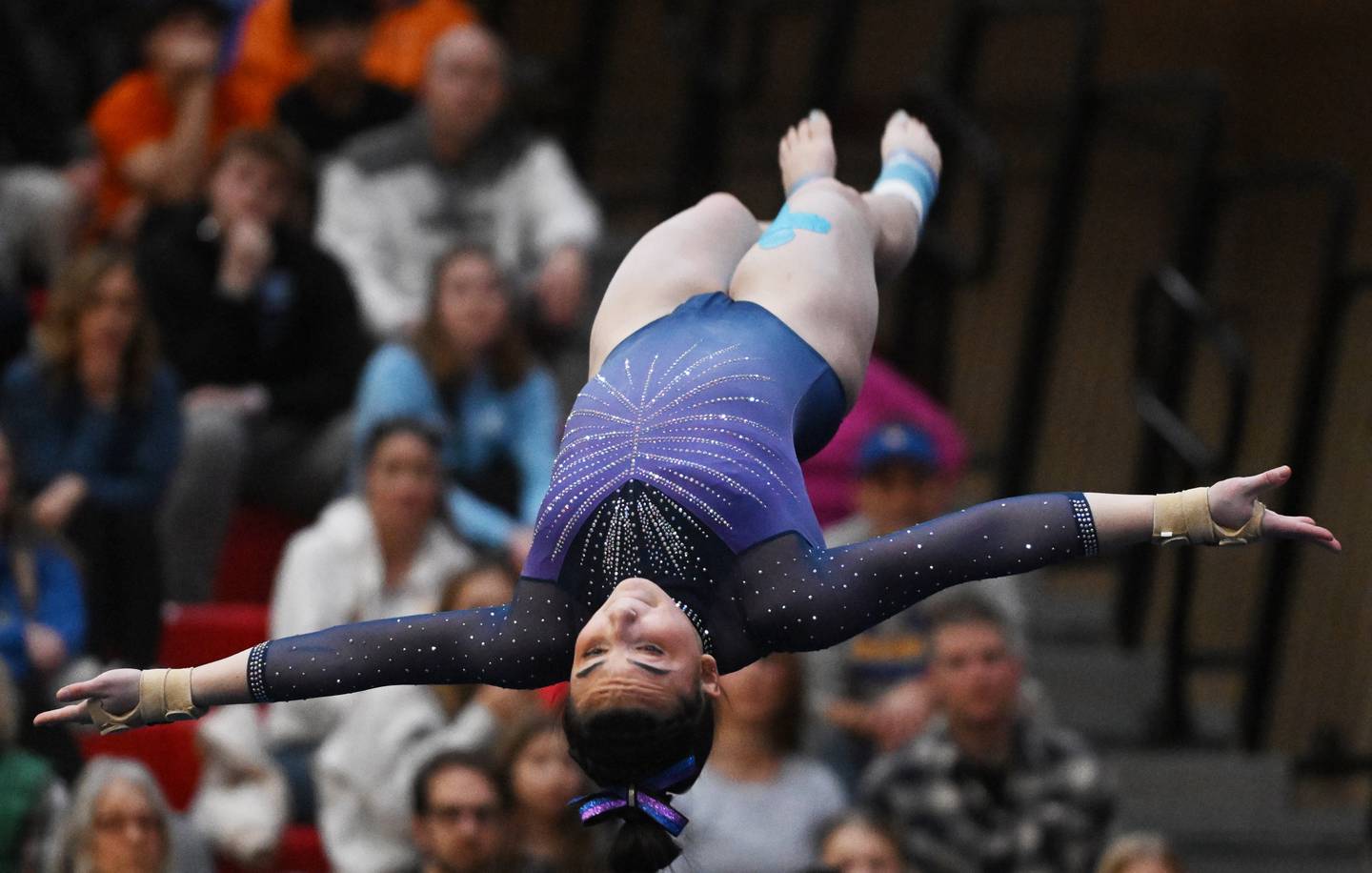 Downers Grove South’s Genevieve Herion competes on floor exercise during the girls state gymnastics meet at Palatine High School on Saturday, Feb. 22, 2025.