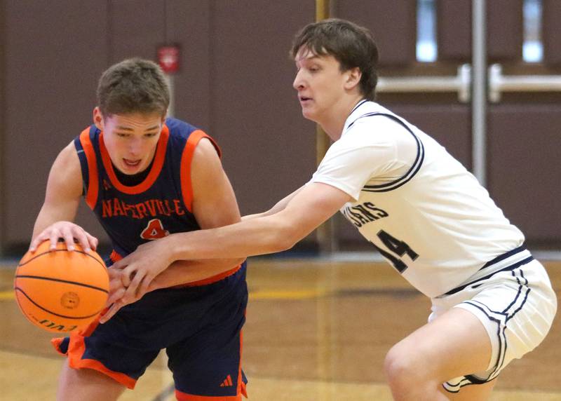 Cary-Grove’s  Evan Bauer, right, guards Naperville North’s Miles Okyne in varsity boys basketball Hinkle Holiday Classic action on Monday, Dec. 21, 2025, at Jacobs High School in Algonquin.