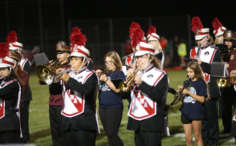 Ottawa High School band members accompanied by grade school bands Wallace, Grand Ridge, Shepheard and Milton Pope play at halftime on Friday, Sept. 12, 2025 at King Field.