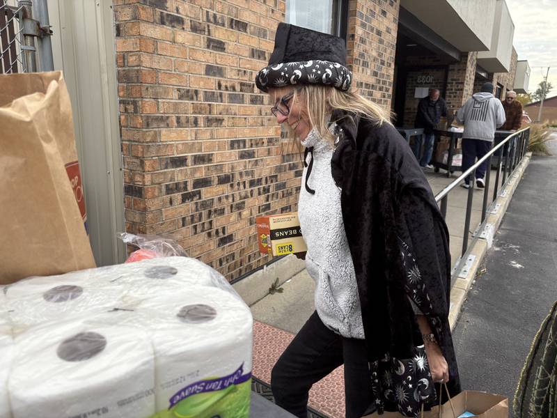 Tammy Gould brings in donations from the Villas at Bull Valley Halloween food drive Oct. 31, 2025.
